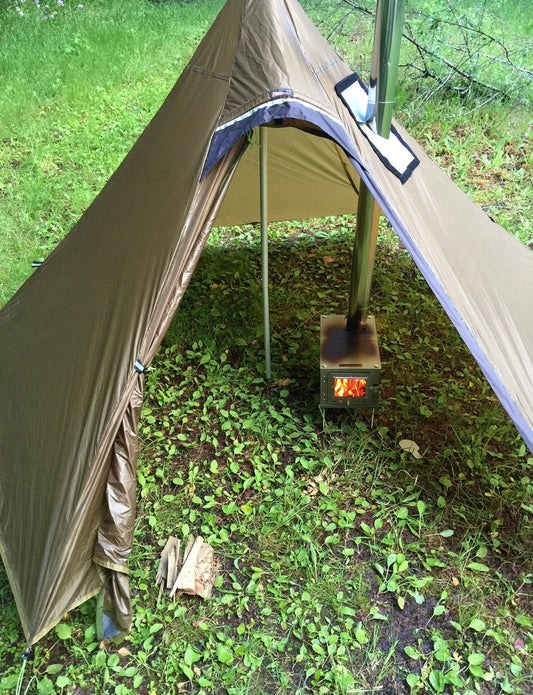 Titanium tent wood stove inside floorless tent