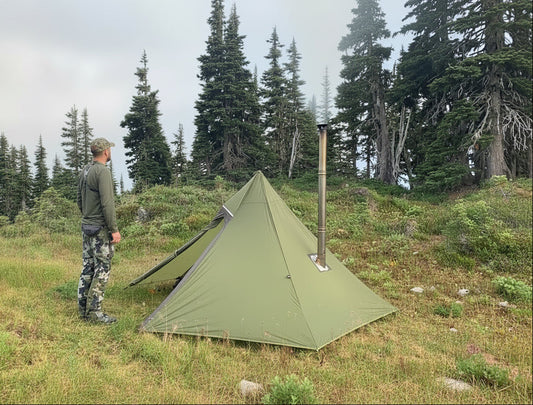 Mountain campsite using a hot tent