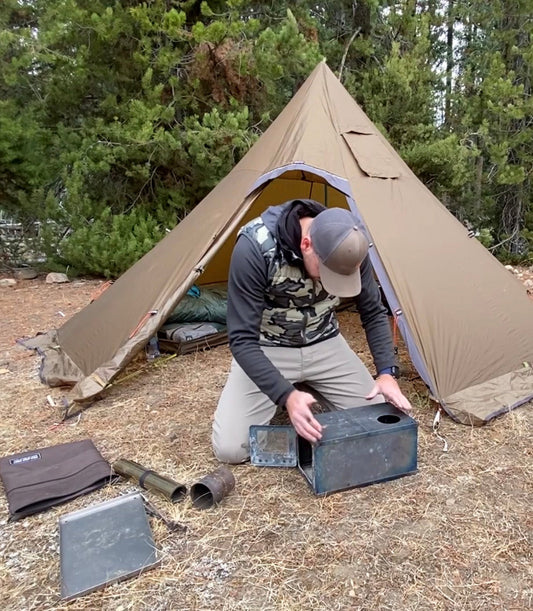 Ultralight backpacking with tent wood stove in campsite