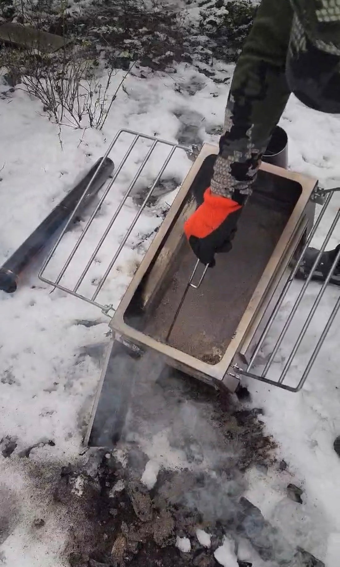 Cleaning a Tent Wood Stove Outdoors