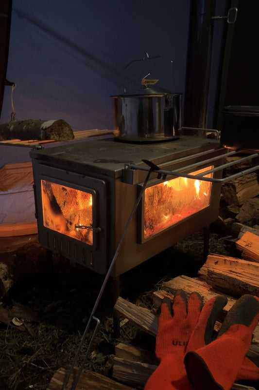 Hot Tent Wood Stove burning firewood for heat and stovetop cooking