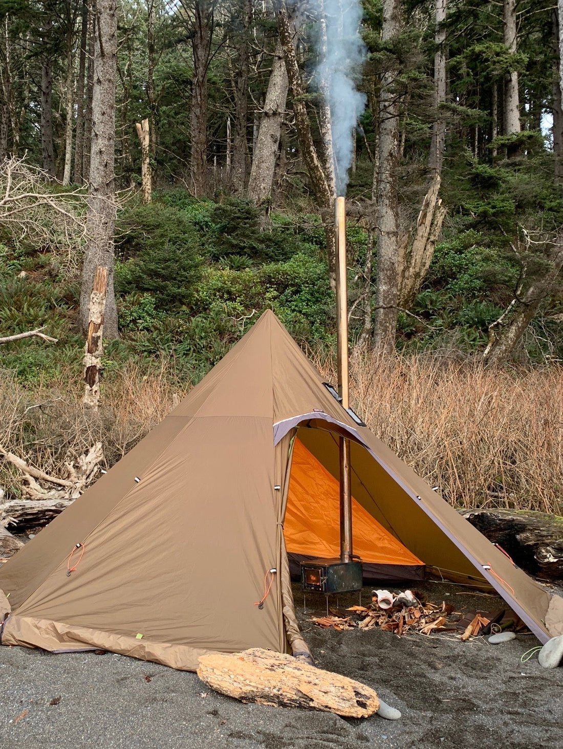 Wood stove in a tent inside a campsite