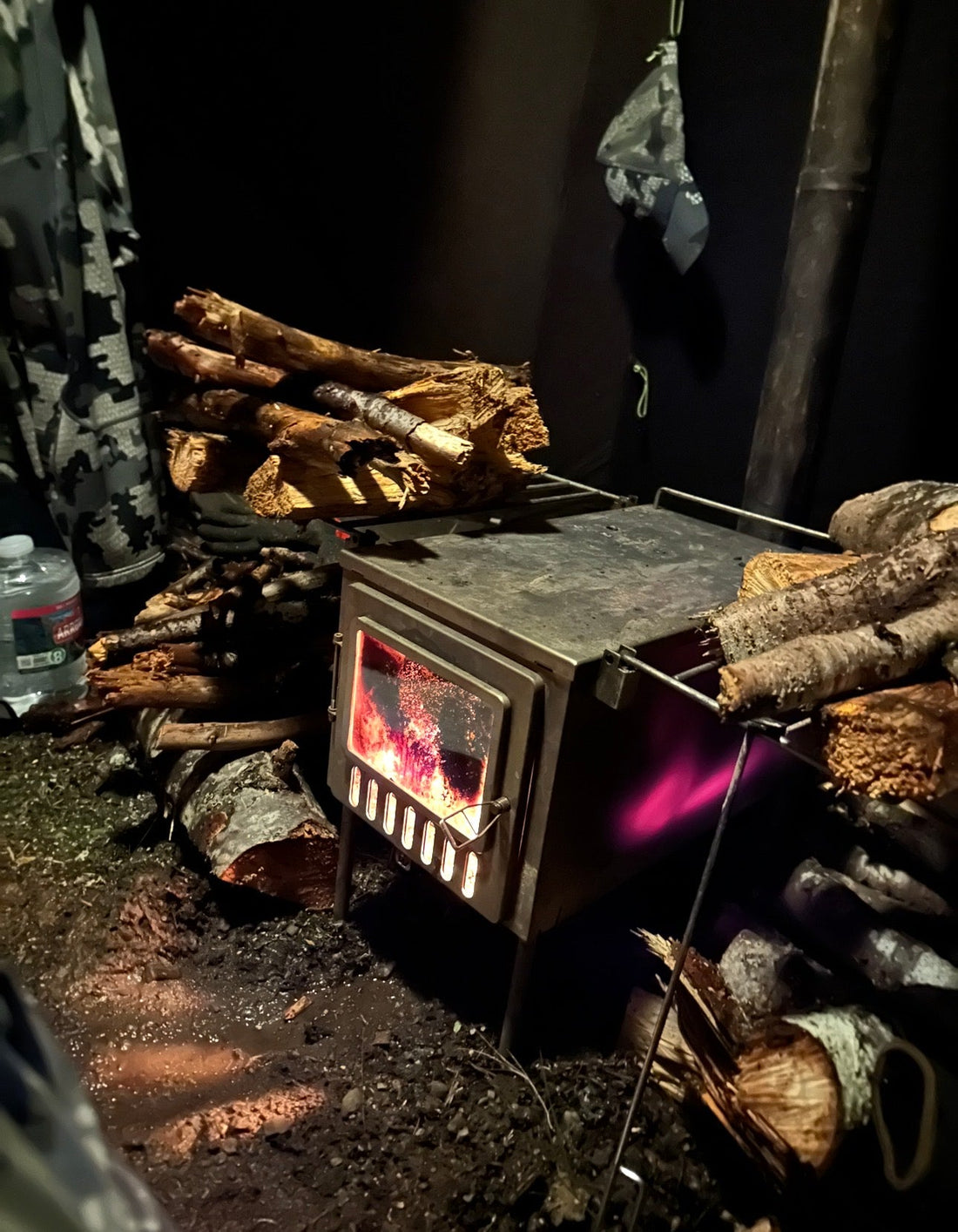 Tent wood stove with dirty fireplace glass