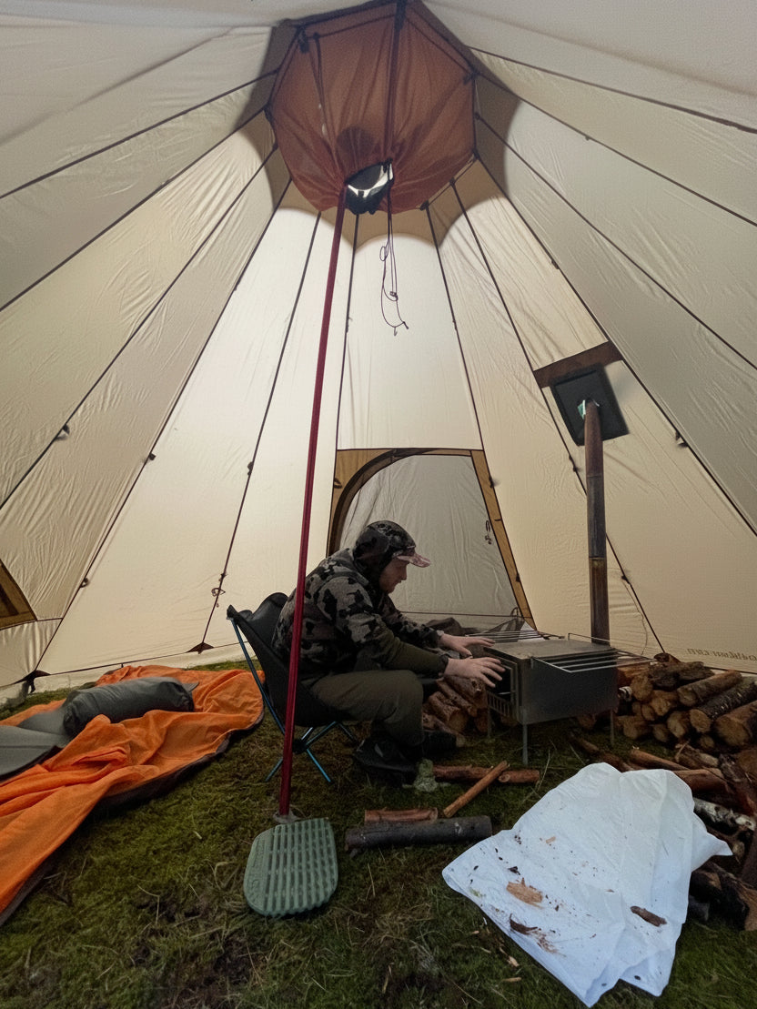 Tent wood stove in backcountry elk campsite