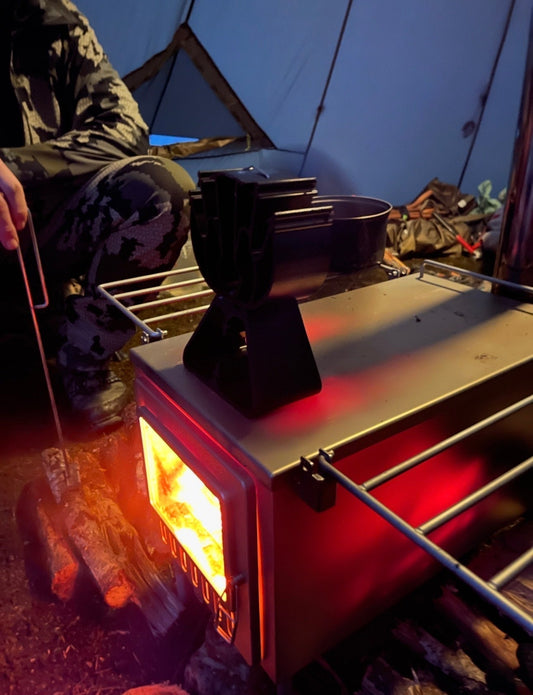 Tent Wood Stove Glowing Red Hot while Camping