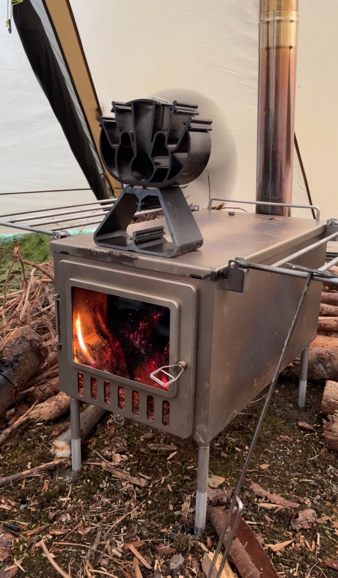 Thermo heat fan on tent wood stove stovetop