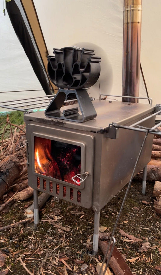 Thermo heat fan on tent wood stove stovetop