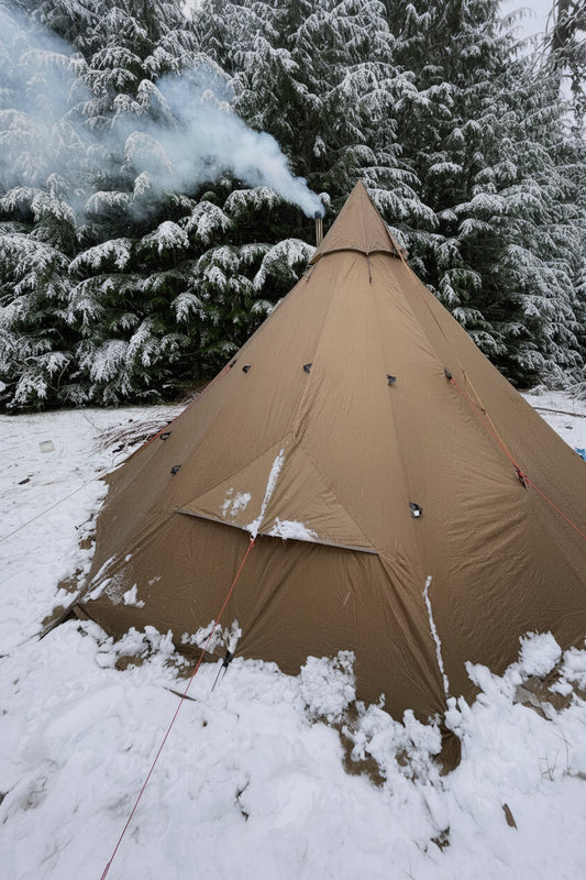 Tipi tent camping with a wood stove in the forest