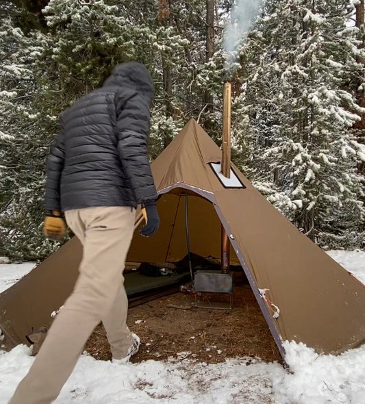 Titanium Tent Wood Stove in Backpacking campsite with snow