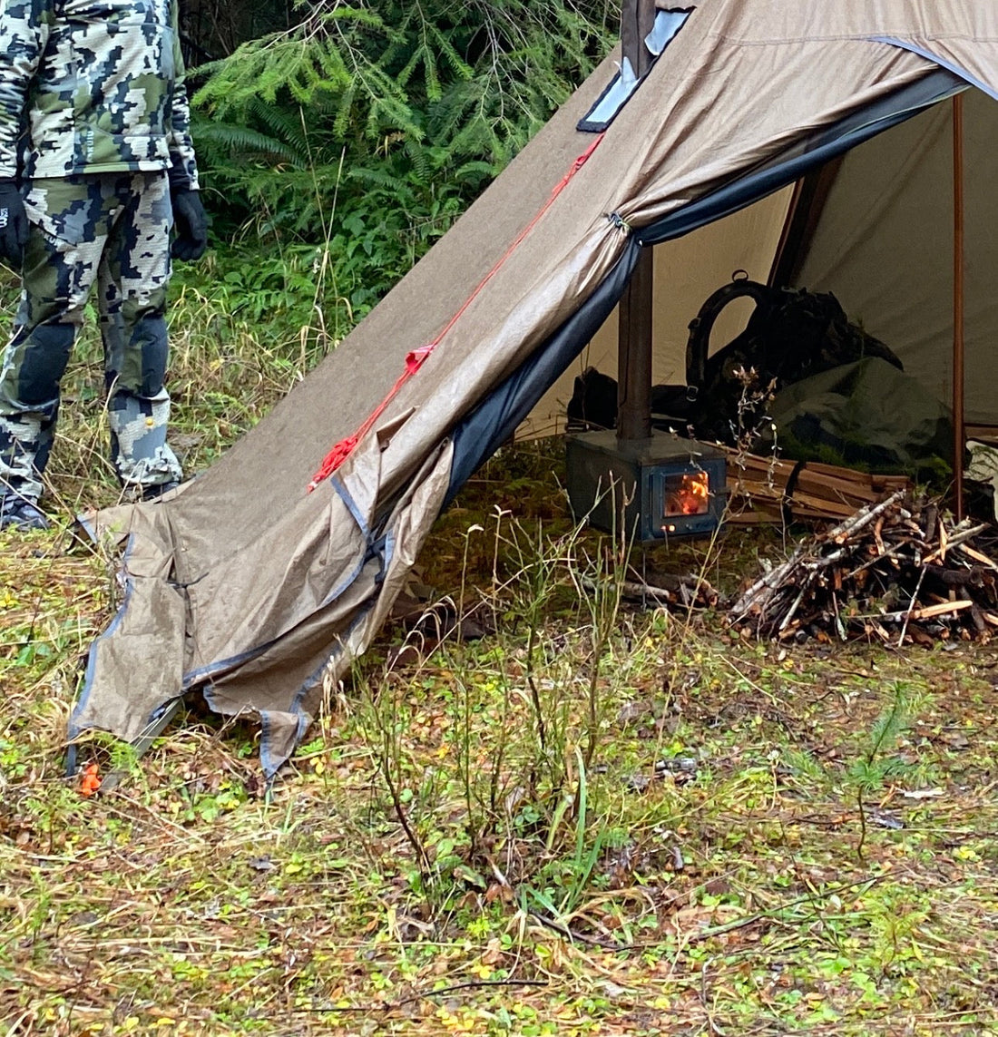 Titanium tent wood stove in hunting camp