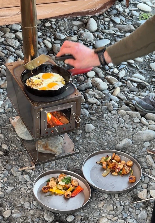 Titanium Tent Wood Stove Cooking with Cast Iron Pan on Stovetop