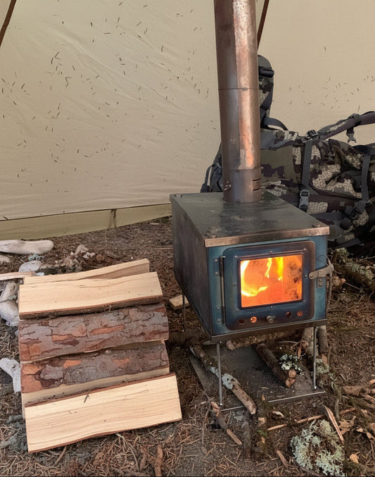 Titanium wood stove burning firewood