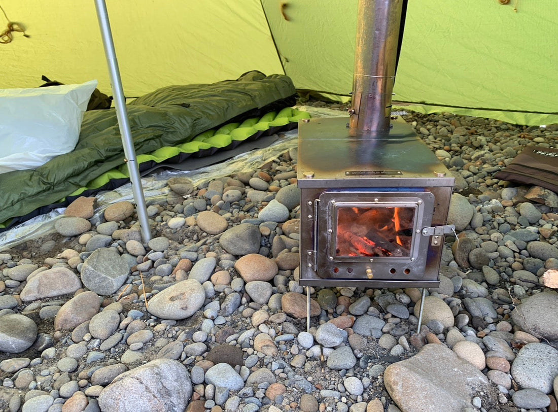 Ultralight wood stove inside floorless tent