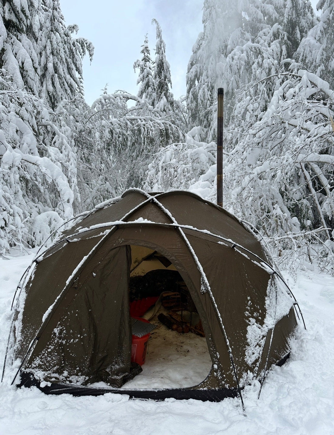 Wood stove inside a standard dome style tent winter camping