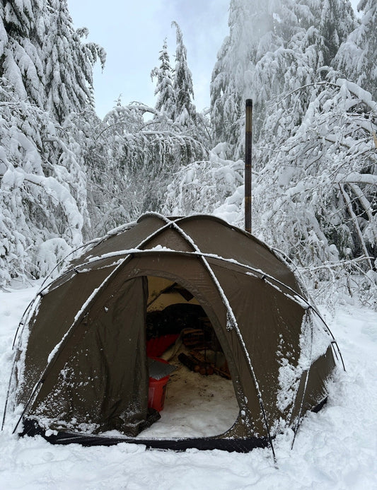 Wood stove inside a standard dome style tent winter camping