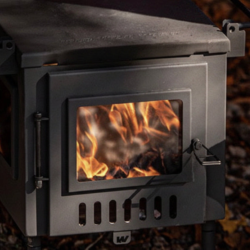 Hunter Hot Tent Stove with campfire burning inside outdoors