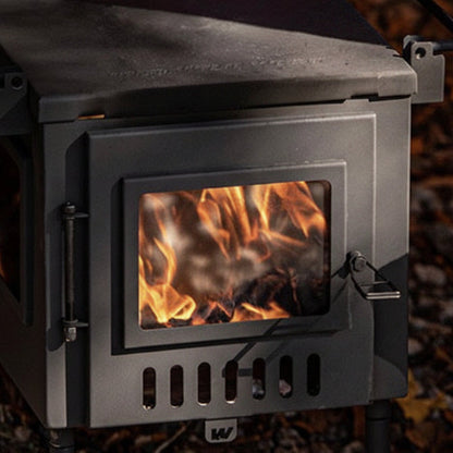 Hunter Hot Tent Stove with campfire burning inside outdoors